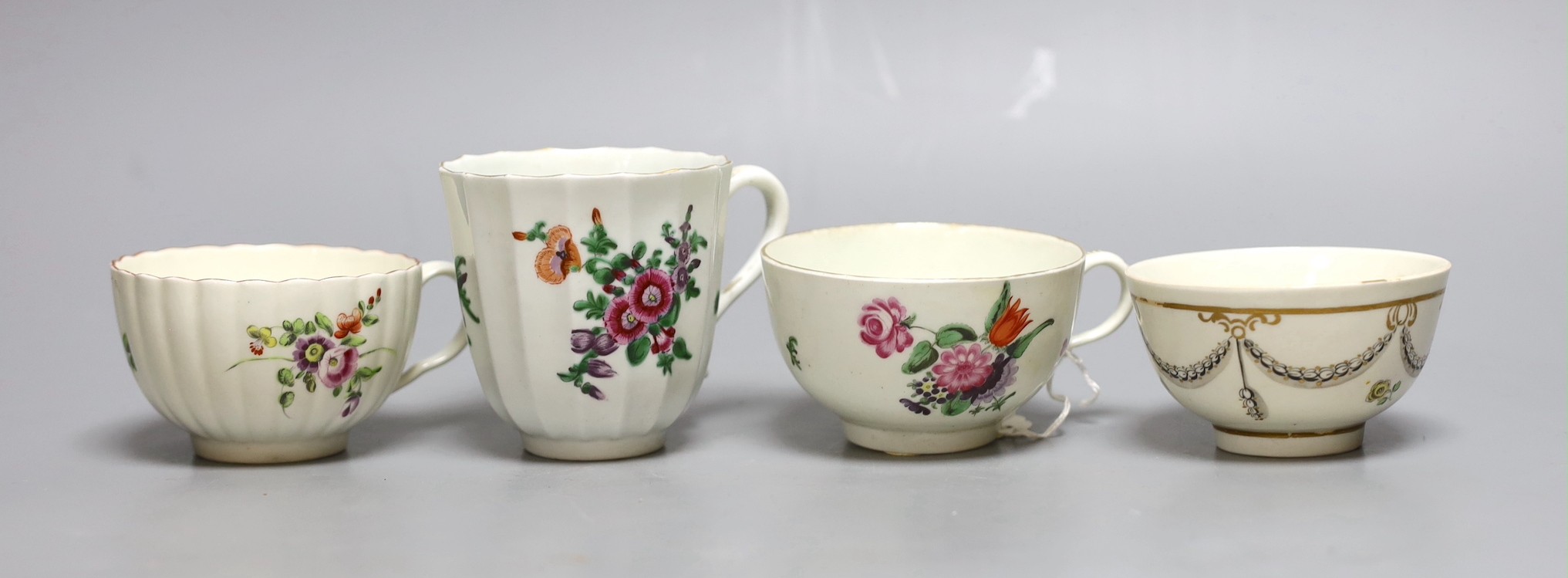 A Worcester tall faceted chocolate cup painted with flowers, a Worcester teacup, purchased Bonhams Zorensky col. part 2 Lot 105, and another Worcester teacup and teabowl